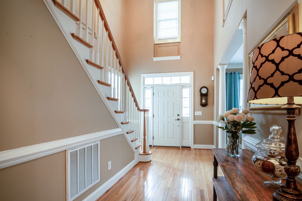 Bright home entrance with staircase