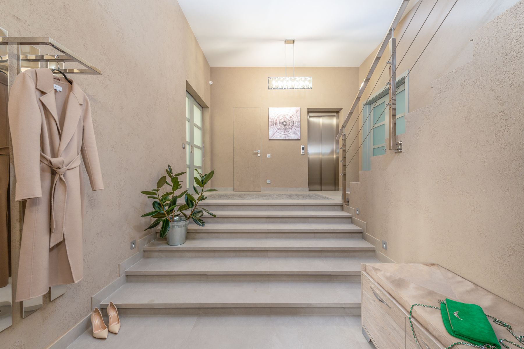 Lobby with elevator and staircase